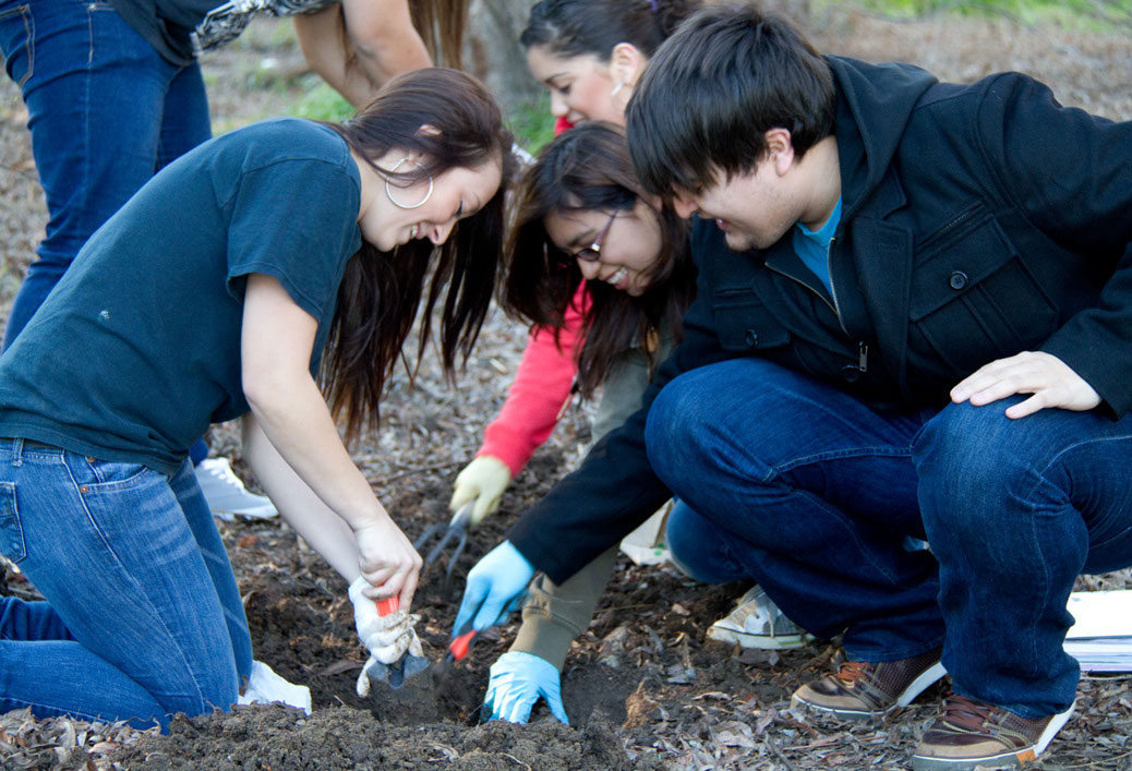 Students on an archeological dig at the LMC lake