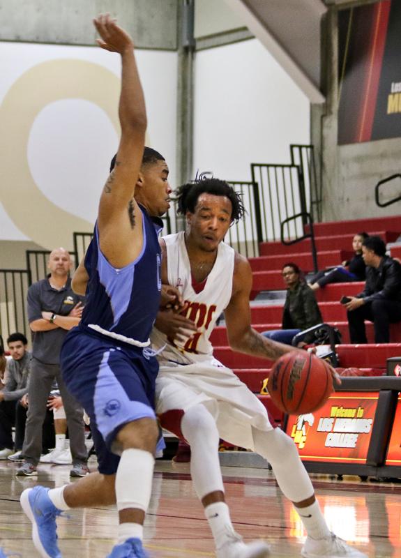 Basketball players colliding