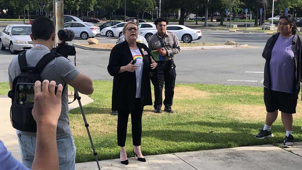 Pamala Ralston giving a speech on Pride Month