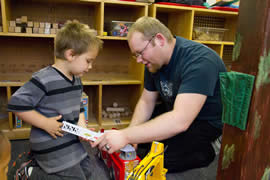 Man playing with child