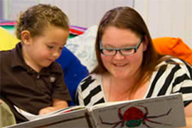 Woman reading to child