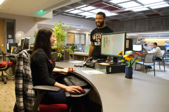 Student Ambassador assisting a male student