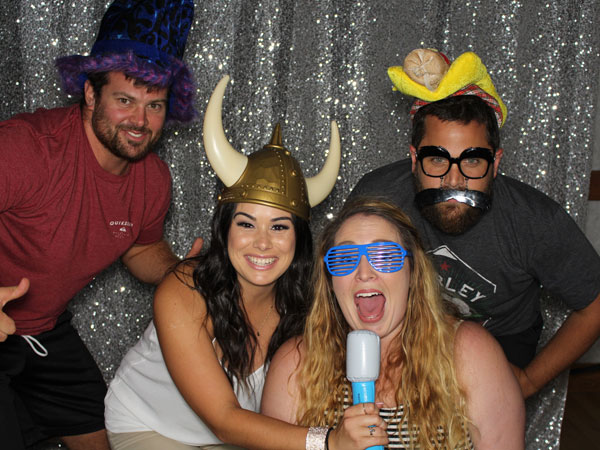 students posing in a photo booth