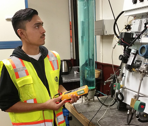 Student Intern checks his work